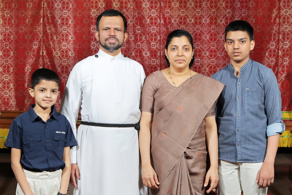 Rev. Binu J. Varghese with his family